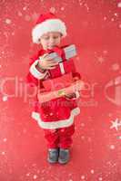 Composite image of cute little boy in santa costume