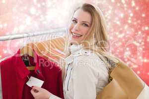 Composite image of blonde shopping