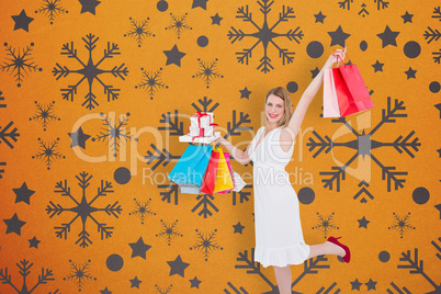 Composite image of elegant blonde with shopping bags and gifts