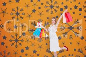Composite image of elegant blonde with shopping bags and gifts
