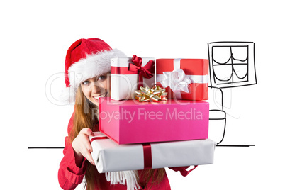 Composite image of festive redhead holding pile of gifts