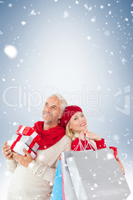 Happy festive couple with gifts and bags