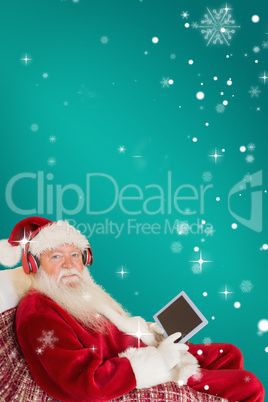 Composite image of father christmas listening to music with tabl