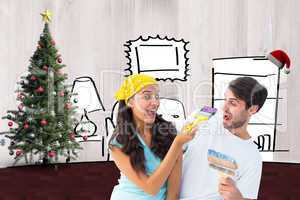 Composite image of happy young couple painting together and laug