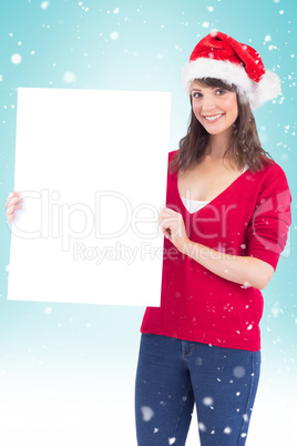 Festive brunette holding a poster Festive brunette holding a poster