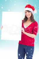 Festive brunette holding a poster