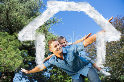 Composite image of son playing with his dad outside
