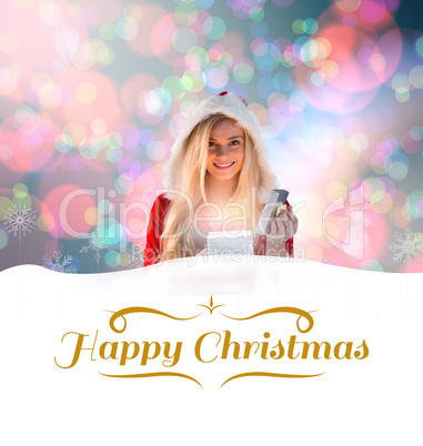 Composite image of sexy santa girl opening gift