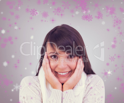 Composite image of brunette in winter clothes smiling at camera