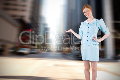 Composite image of pretty air hostess presenting with hand