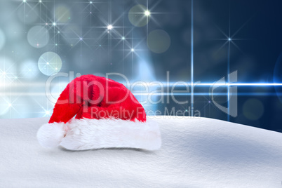 Composite image of santa hat on snow