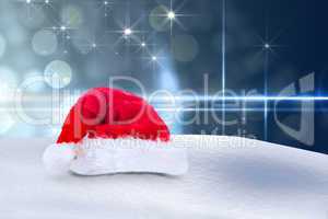 Composite image of santa hat on snow