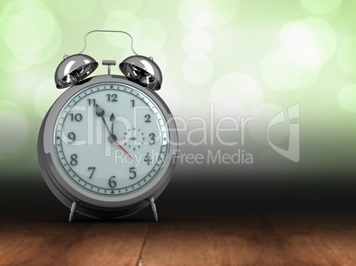 Composite image of alarm clock counting down to twelve