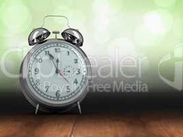 Composite image of alarm clock counting down to twelve