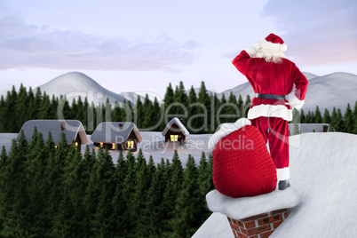 Composite image of santa on cottage roof