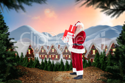 Composite image of santa carries a few presents