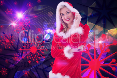 Composite image of festive blonde smiling at camera