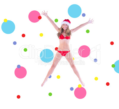 Composite image of festive fit blonde in red bikini