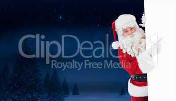 Composite image of smiling santa claus pointing poster