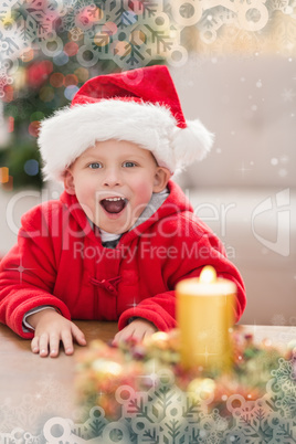 Composite image of festive little boy smiling at camera