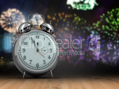 Composite image of alarm clock counting down to twelve