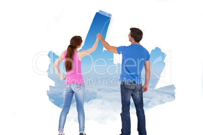 Composite image of couple painting together