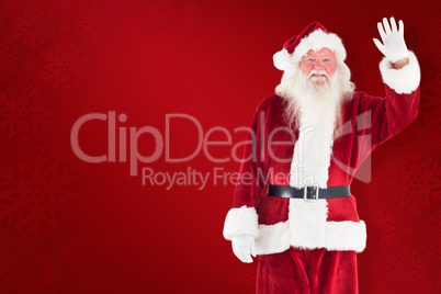 Composite image of jolly santa waving at camera