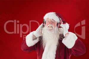 Composite image of santa claus enjoys some music