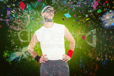 Composite image of geeky hipster posing in sportswear