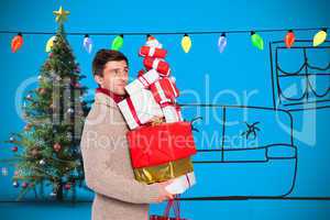 Composite image of young man with many christmas presents