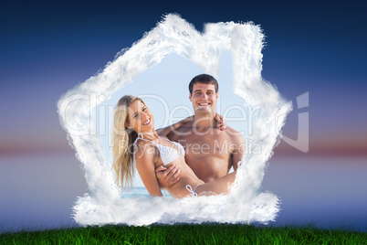 Composite image of man carrying his pretty girlfriend smiling at