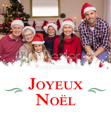 Composite image of multigeneration family wearing santa hats on