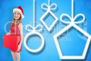 Composite image of smiling woman in santa hat holding box