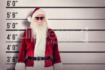 Composite image of santa claus wears black sunglasses