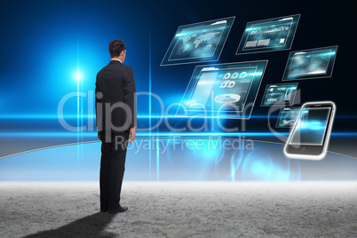 Composite image of businessman turning his back to camera