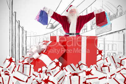 Composite image of santa standing in large gift