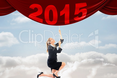 Composite image of businesswoman pulling a chain