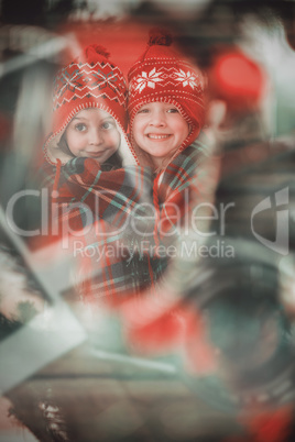 Composite image of festive little girls under a blanket