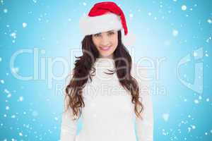 Composite image of beautiful brunette in santa hat smiling at ca