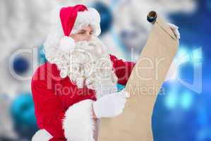 Composite image of santa checking list