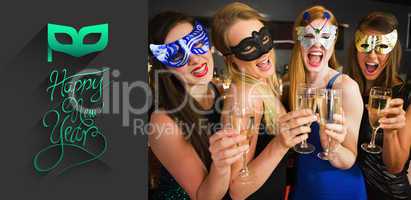 Composite image of attractive friends with masks on holding cham