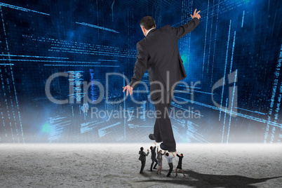 Composite image of business people supporting boss