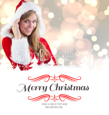 Composite image of festive blonde smiling at camera