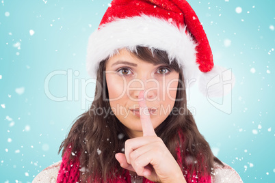 Composite image of portrait of a brunette keeping a secret