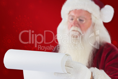 Composite image of santa claus reads a list