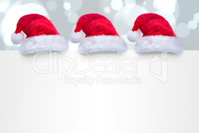 Composite image of santa hat on poster