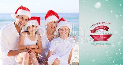 Composite image of family during christmas day at the beach