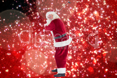 Composite image of santa claus swings his golf club