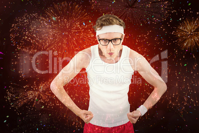 Composite image of geeky hipster posing in sportswear