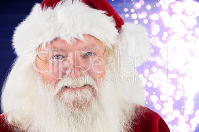 Composite image of santa smiling at camera